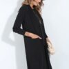 Woman wearing black flare stretch pants paired with a mid-length cardigan and racerback top – coordinated loungewear set made in South Africa Woman wearing black flare stretch pants paired with a mid-length cardigan and racerback top – coordinated loungewear set made in South Africa